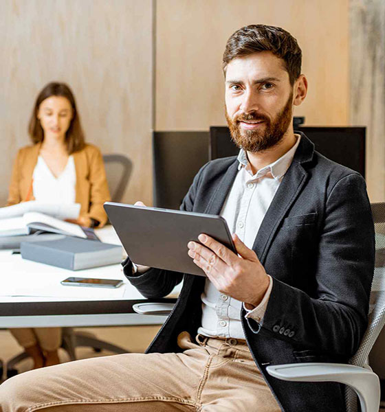 https://capitalhr.com.au/wp-content/uploads/2024/07/young-professional-holding-a-tablet.jpg
